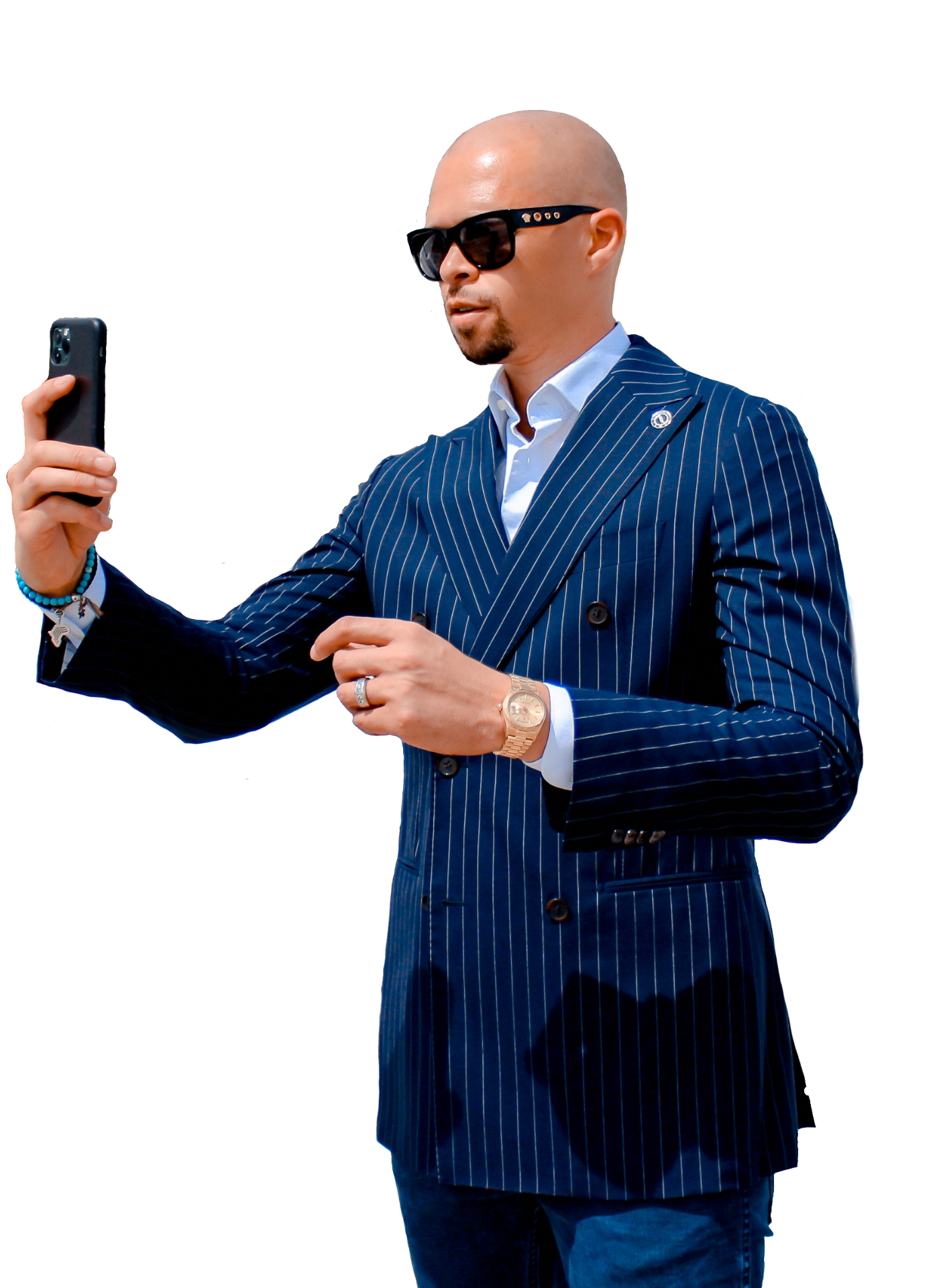 image of Matthew Harris, with a suit jacket and cell phone, taking a selfie